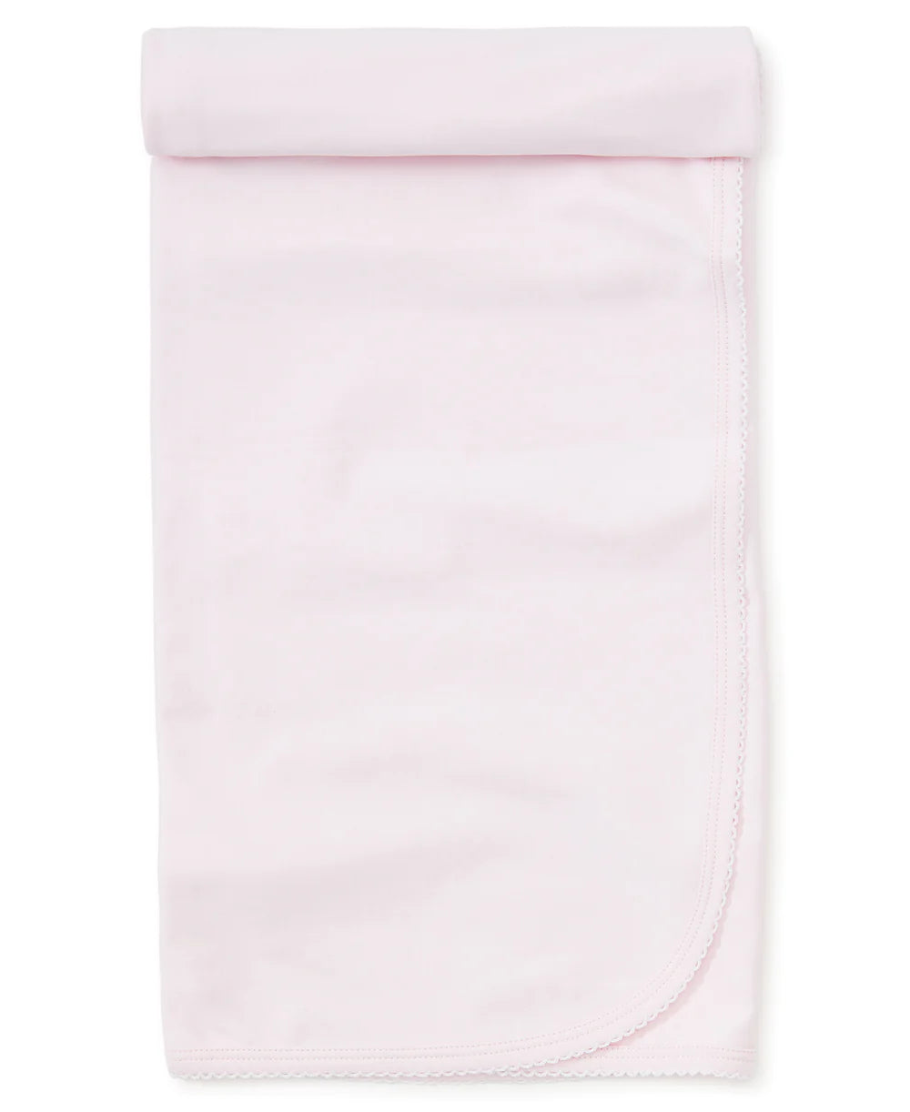 Pink blanket with white trim